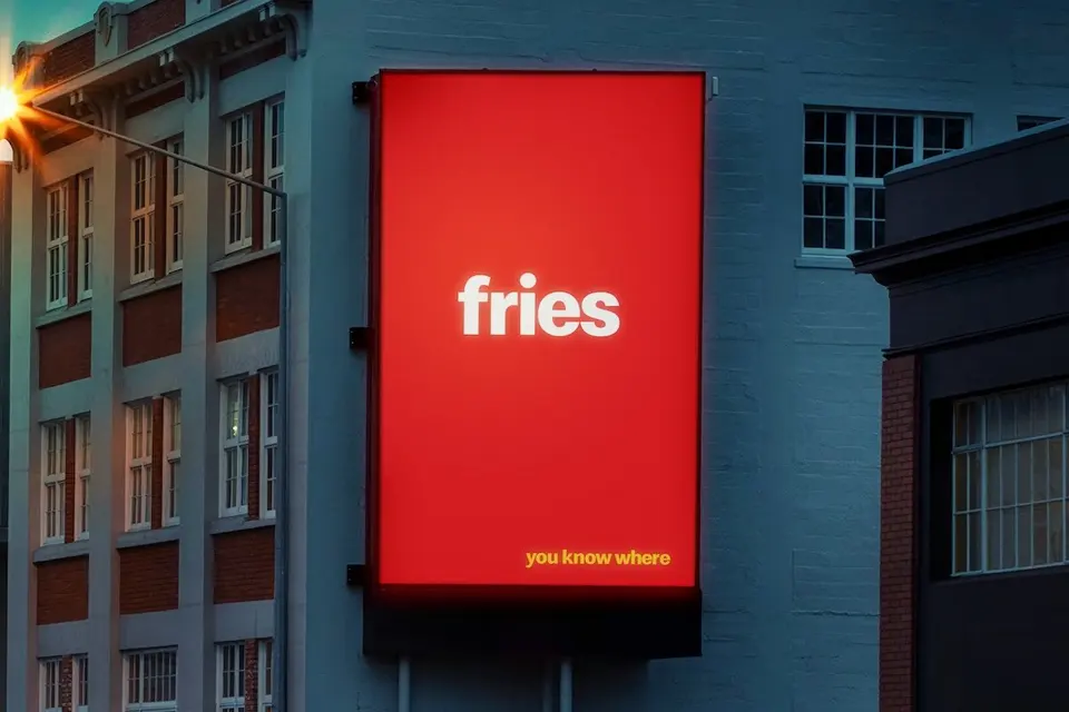 Red billboard reading “fries — you know where”, with no logo